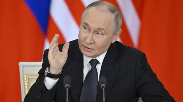 Russian President Vladimir Putin speaking at the Kremlin on rising global instability and international security concerns.