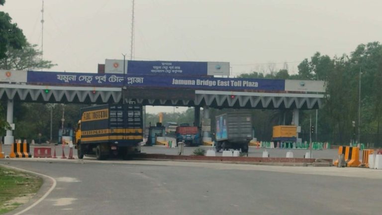 Vehicles crossing Jamuna Bridge toll plaza during Eid rush in Bangladesh